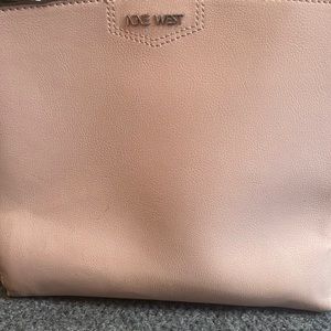 Nine West purse in a light pink comes with a shoulder strap